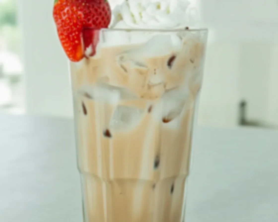 5 Delicious Ways to Enjoy Chocolate Italian Cream Soda 1 A delicious Chocolate Italian Cream Soda topped with whipped cream and served in a glass.